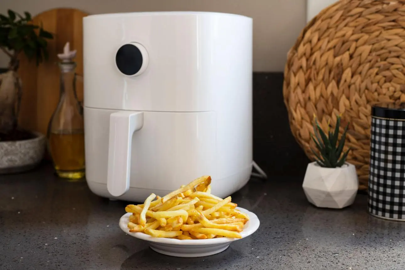 Air fryer chicken and sides served in a home kitchen