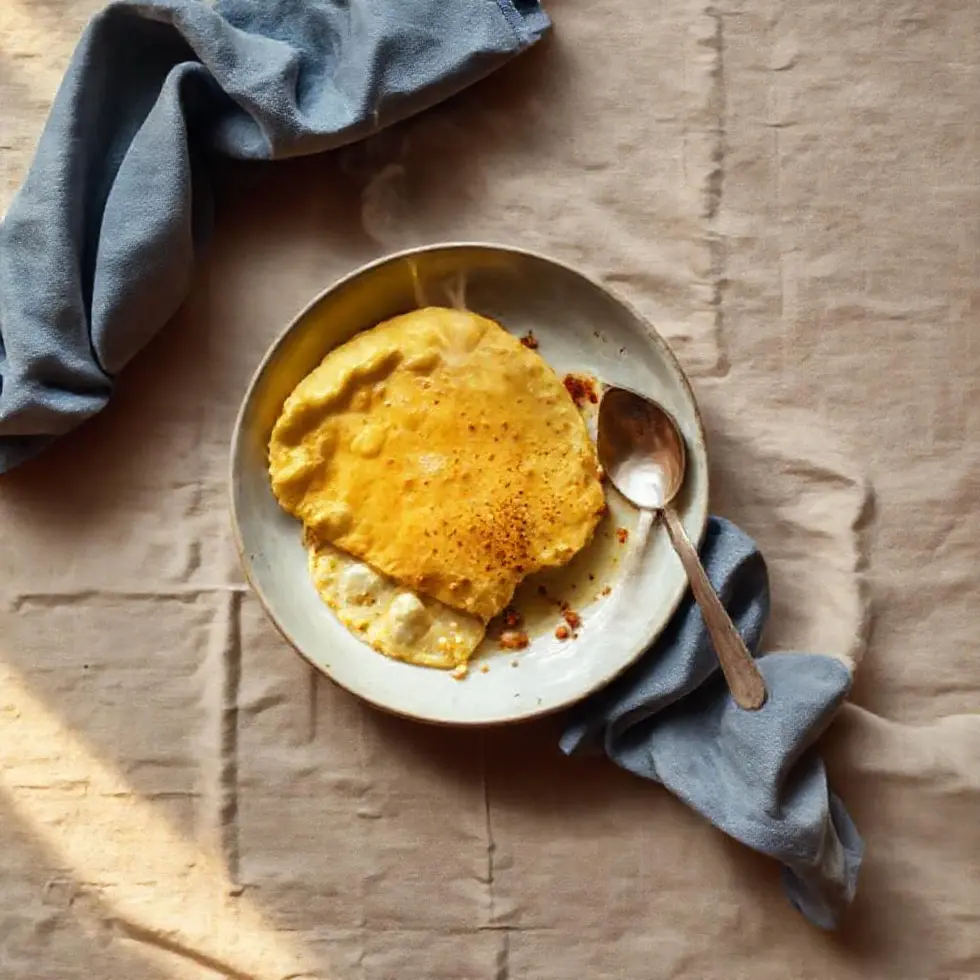 Homemade omelette served in a cozy morning kitchen setting